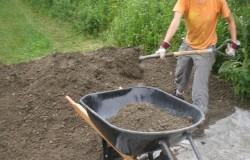 Kate shovels steadily...